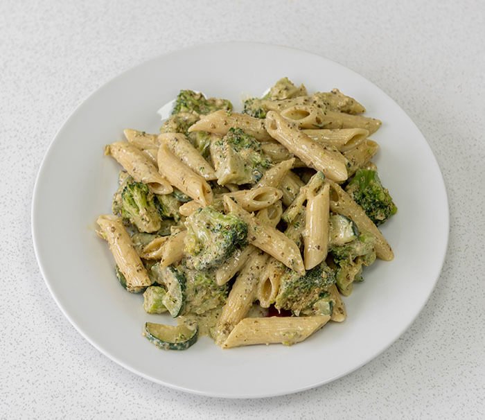 Bowl of pasta with broccoli and pesto sauce